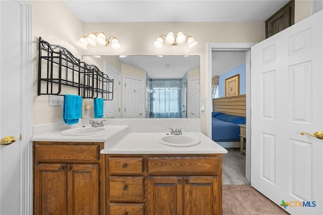 4105 Whispering Oaks, Temple, TX 76504 - full bathroom with double vanity, tile patterned flooring, and a stall shower