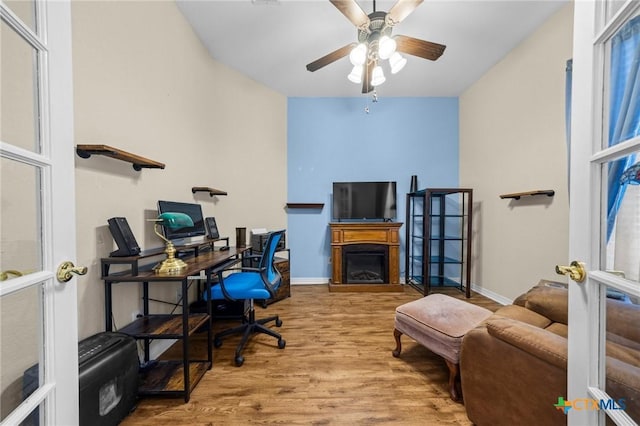 4105 Whispering Oaks, Temple, TX 76504 - office featuring wood finished floors, a ceiling fan, and a fireplace