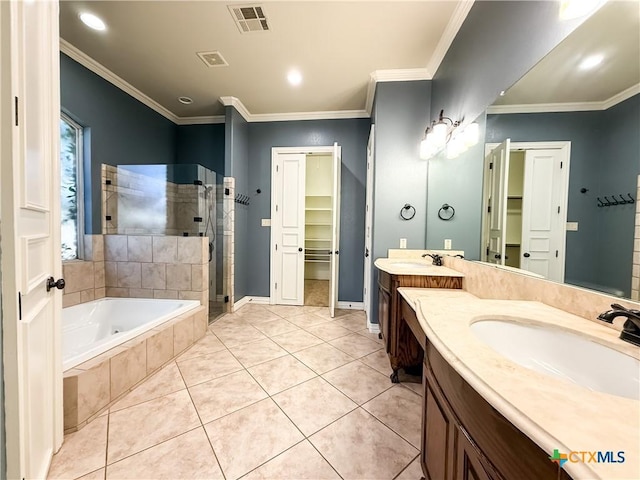 full bath with crown molding, visible vents, a sink, a shower stall, and tile patterned flooring