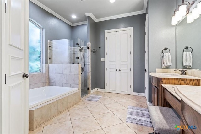 bathroom with tile patterned floors, vanity, independent shower and bath, and ornamental molding