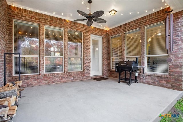 view of patio / terrace featuring ceiling fan and a grill