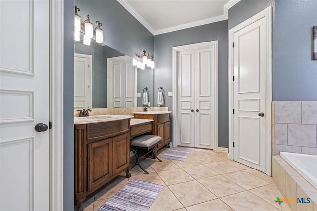 bathroom with tile patterned flooring, vanity, a relaxing tiled tub, and ornamental molding