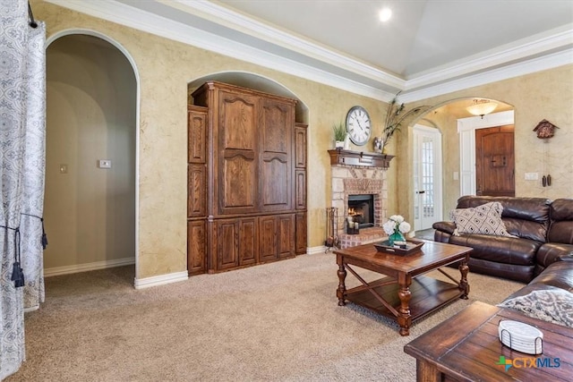 living room with crown molding, light carpet, and a brick fireplace