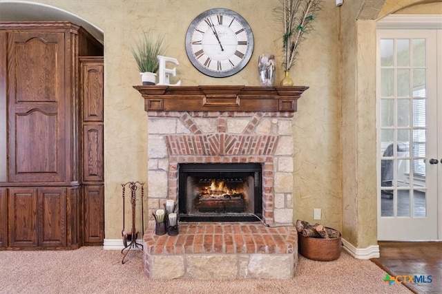 details featuring a fireplace and carpet