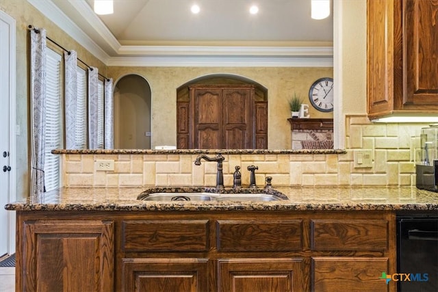 bathroom with ornamental molding, tasteful backsplash, lofted ceiling, and vanity