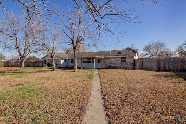 ranch-style house with a front yard