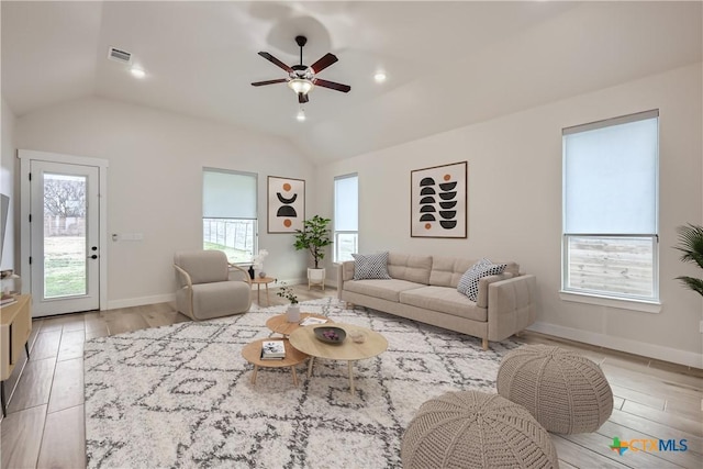 living room with vaulted ceiling, ceiling fan, and light hardwood / wood-style floors