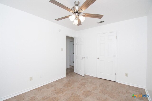 5111 Warwicke Dr, Temple, TX 76502 - unfurnished bedroom featuring baseboards and a ceiling fan