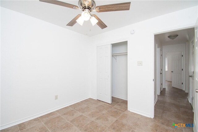 5111 Warwicke Dr, Temple, TX 76502 - unfurnished bedroom featuring a closet, baseboards, and ceiling fan