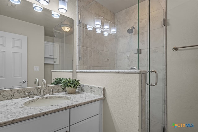 bathroom featuring vanity and walk in shower