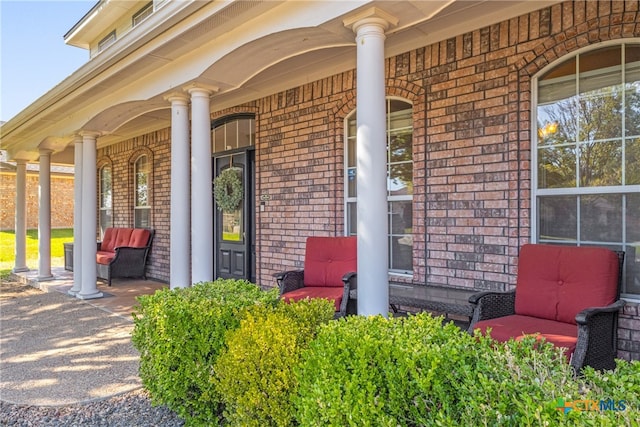 entrance to property featuring covered porch