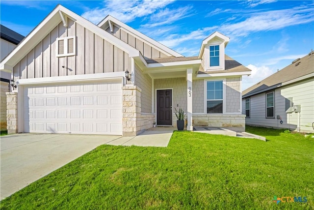 view of front of home with a garage and a front lawn