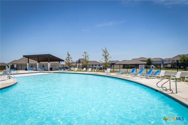 view of swimming pool with a patio