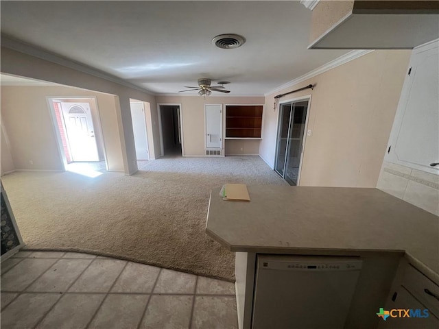 interior space with dishwasher, ornamental molding, visible vents, and light carpet