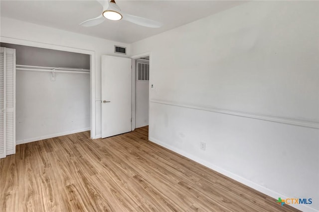 3005 Redwood Dr, Victoria, TX 77901 - unfurnished bedroom with wood finished floors, baseboards, a closet, and a ceiling fan