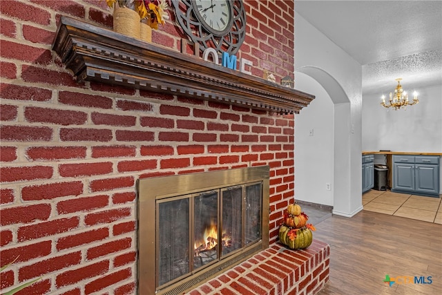 interior details with a fireplace and hardwood / wood-style flooring