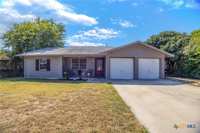 single story home with a front yard and a garage