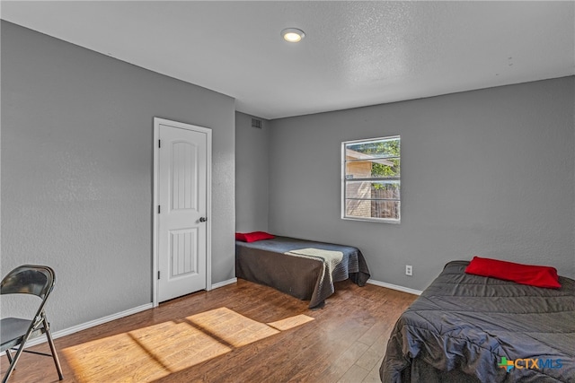 bedroom featuring hardwood / wood-style floors