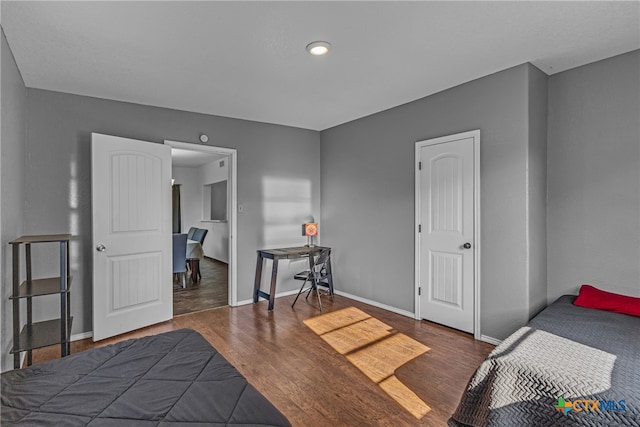 bedroom featuring dark hardwood / wood-style floors