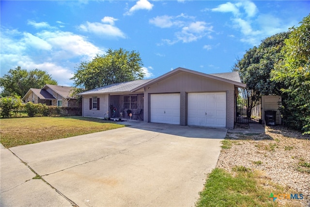 ranch-style house with a garage and a front lawn