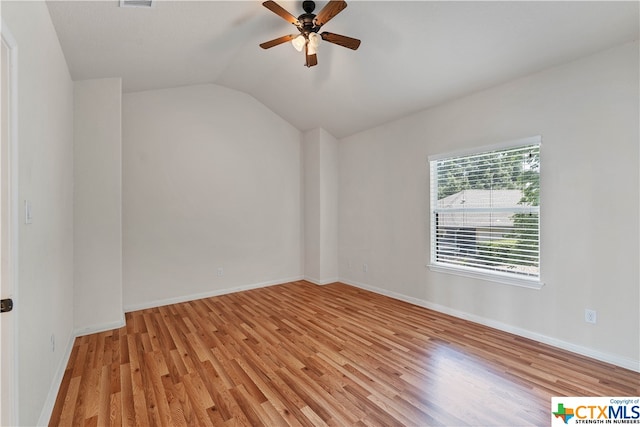 empty room with light hardwood / wood-style floors, lofted ceiling, and ceiling fan