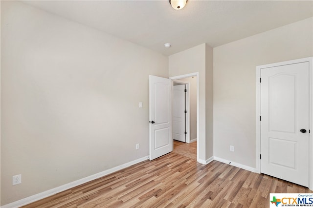 unfurnished bedroom featuring light hardwood / wood-style flooring