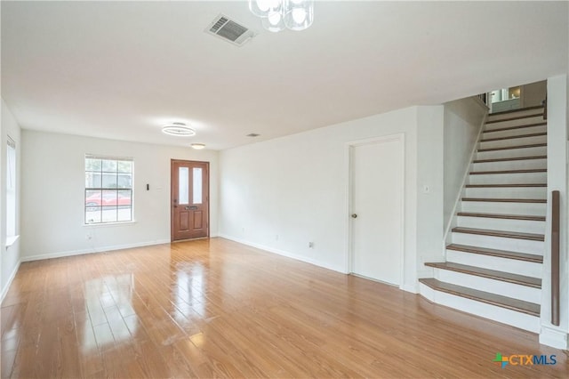 unfurnished living room with light hardwood / wood-style floors