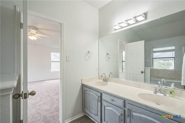 bathroom featuring vanity and ceiling fan