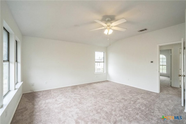 carpeted empty room featuring ceiling fan