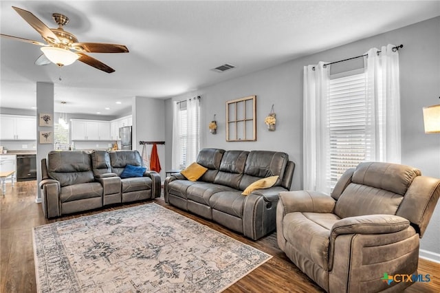 living area with recessed lighting, wood finished floors, visible vents, and a ceiling fan