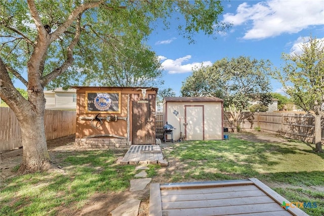view of shed with a fenced backyard