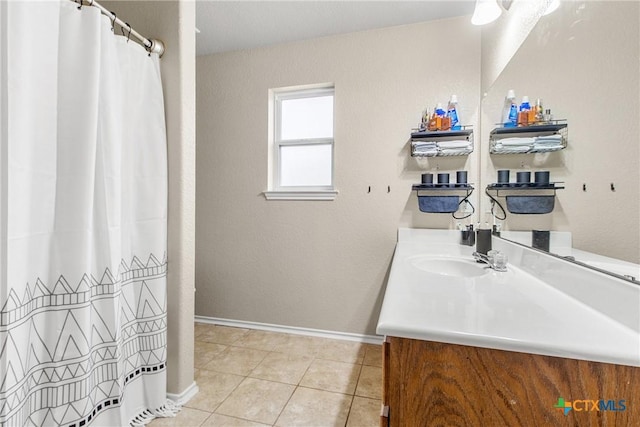 bathroom featuring tile patterned floors and vanity