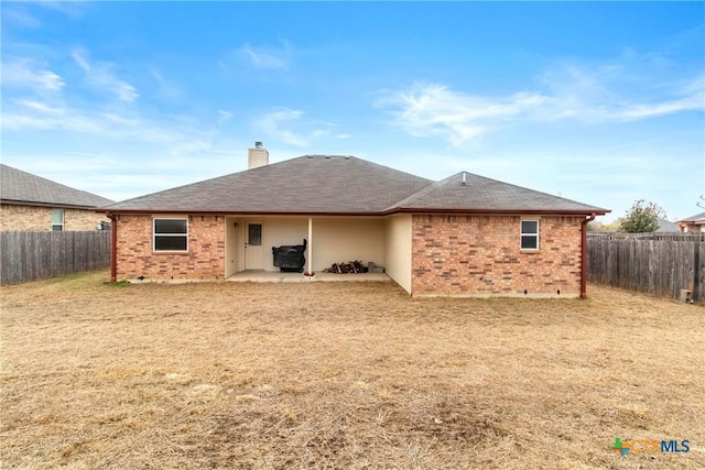 rear view of house featuring a patio