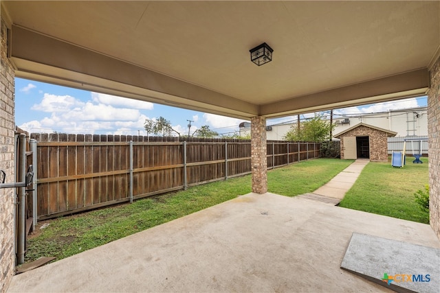 view of patio / terrace featuring a storage shed