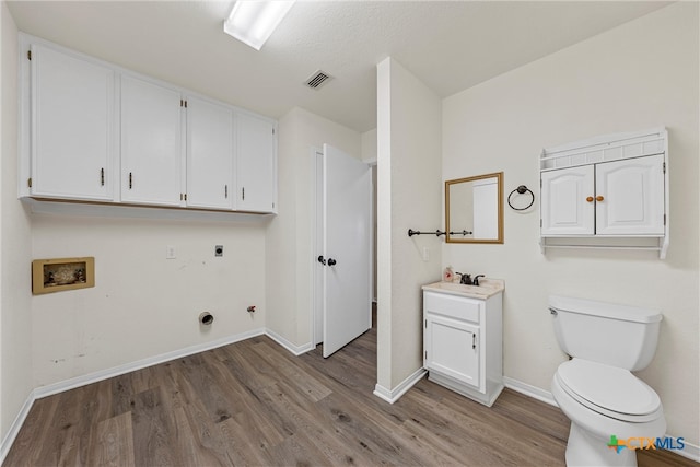 washroom with washer hookup, wood-type flooring, and hookup for an electric dryer