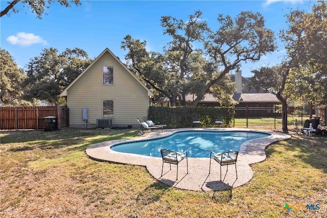 view of pool featuring central air condition unit and a lawn