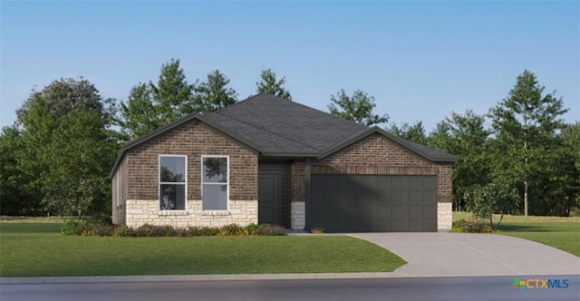 view of front of house featuring a garage and a front yard