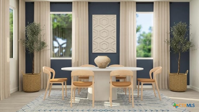 dining space featuring light wood-type flooring