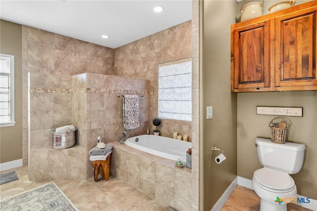 bathroom with tiled bath and toilet