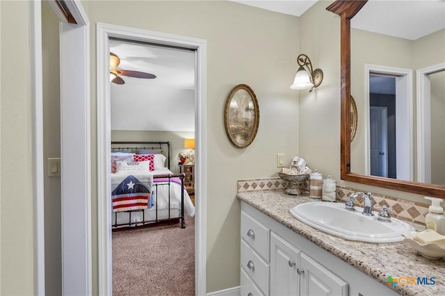 bathroom featuring ceiling fan and vanity