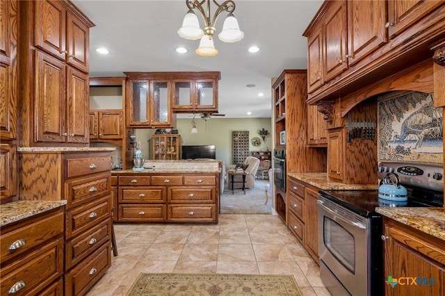 kitchen featuring stainless steel appliances, light stone counters, a notable chandelier, pendant lighting, and light tile patterned flooring