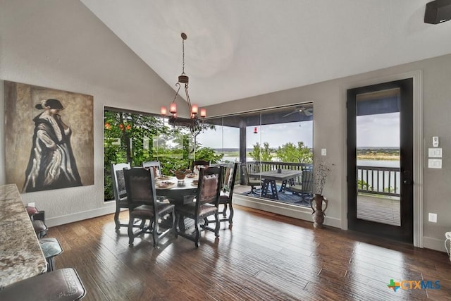 1746 Stagecoach Dr, Canyon Lake, TX 78133 - dining space with a chandelier, dark wood finished floors, and high vaulted ceiling