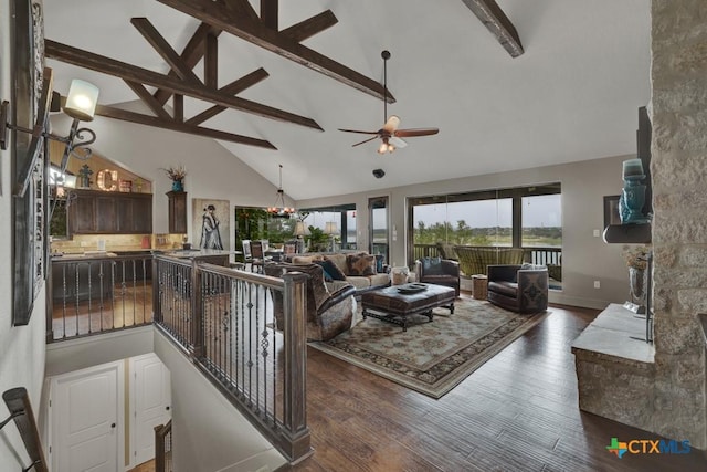 1746 Stagecoach Dr, Canyon Lake, TX 78133 - living room with beam ceiling, ceiling fan, a chandelier, dark wood finished floors, and high vaulted ceiling