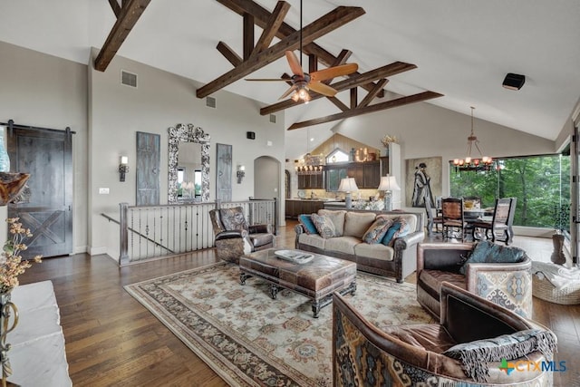 1746 Stagecoach Dr, Canyon Lake, TX 78133 - living area featuring a chandelier, beam ceiling, high vaulted ceiling, arched walkways, and wood finished floors