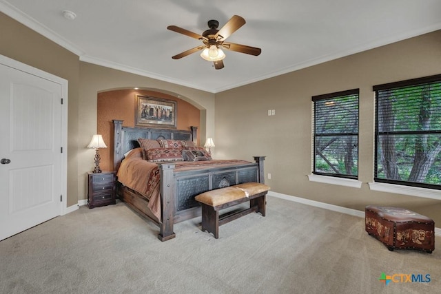 1746 Stagecoach Dr, Canyon Lake, TX 78133 - bedroom with ornamental molding, carpet floors, ceiling fan, and arched walkways