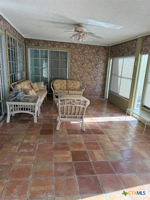 sunroom with ceiling fan