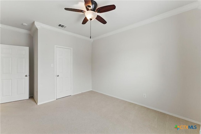 1711 Kelly Ct, New Braunfels, TX 78130 - unfurnished bedroom featuring crown molding, light colored carpet, and a ceiling fan