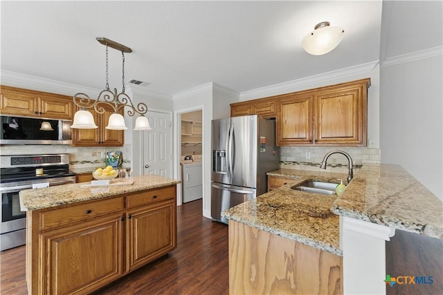 1711 Kelly Ct, New Braunfels, TX 78130 - kitchen featuring appliances with stainless steel finishes, ornamental molding, a peninsula, decorative backsplash, and light stone countertops