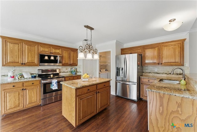 1711 Kelly Ct, New Braunfels, TX 78130 - kitchen featuring stainless steel appliances, washing machine and dryer, light stone counters, decorative backsplash, and crown molding