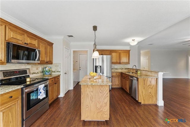 1711 Kelly Ct, New Braunfels, TX 78130 - kitchen with appliances with stainless steel finishes, a peninsula, tasteful backsplash, a center island, and light stone countertops